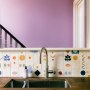 Victorian Terrace, Waterloo | Bespoke kitchen wall tiles looking out onto a vibrant pink landing space | Interior Designers